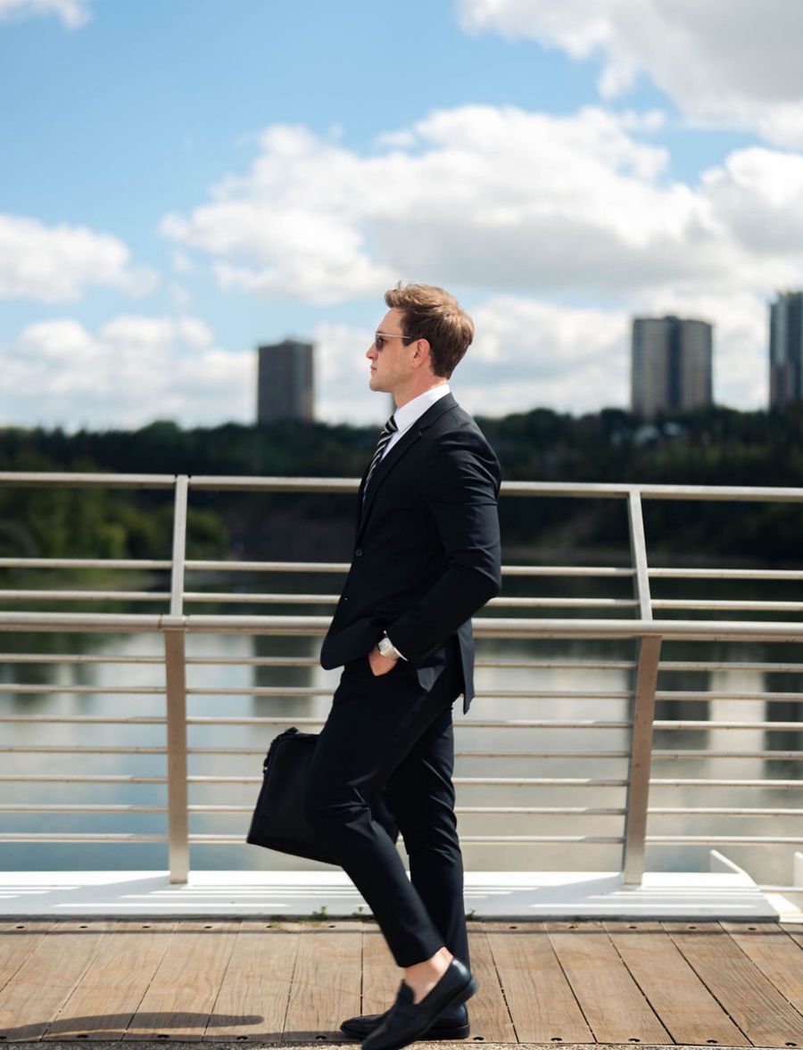 Tyler Rebkowich walking along the river